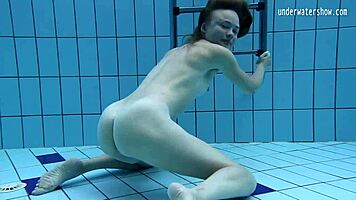 look at clara's small tits underwater in the pool