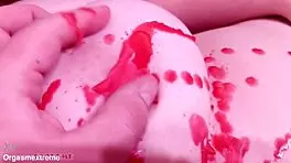Pale redhead with big boobs endures wax play and nipple squeezing in BDSM.