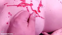 Pale redhead with big boobs endures wax play and nipple squeezing in BDSM.