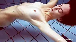 i'm martina, gorgeous redhead teen with big tits swimming in outdoor shower. horny and smoking underwater, tits showing.