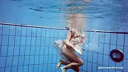 i'm martina, gorgeous redhead teen with big tits swimming in outdoor shower. horny and smoking underwater, tits showing.