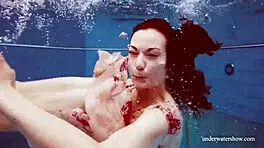 i'm martina, gorgeous redhead teen with big tits swimming in outdoor shower. horny and smoking underwater, tits showing.