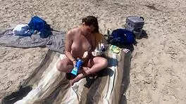 sexy blonde teen 18+ strips nude on public beach. she masturbates openly outdoors.