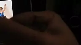 Man jerks off cock and watches porn and cums - slow motion