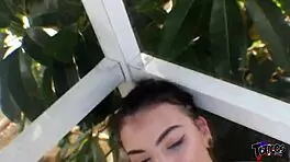 Cute white teen strokes her friend's long black cock in jean shorts outdoors for fun.