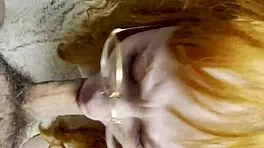 Red-haired vixen teases with wild sucking