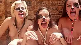 Hey, these three drooling topless sluts are sitting outside, sticking tongues out with heavy makeup for spit fetish.