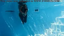 With her clothes set aside, Yorgelis seduces the producer by the pool underwater.