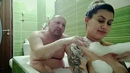 Pregnant girl bathes with husband