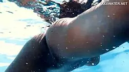 With her clothes set aside, Yorgelis seduces the producer by the pool underwater.