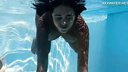 With her clothes set aside, Yorgelis seduces the producer by the pool underwater.