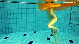 Nastya strips clothes and shows body in pool