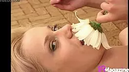 ana fey explores petals in her undergarments during a nature ritual