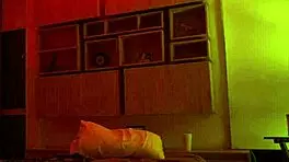 Linda Houston dances seductively under the full red light, captivating everyone with her moves