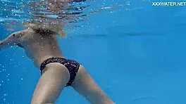 casual-narrative cute blonde mimi cica swimming underwater in pool