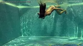 stefanie moon and vyvan hill splashing underwater in pool