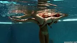 stefanie moon and vyvan hill splashing underwater in pool