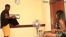 On an African street, a handyman technician bangs his client hard. Unprecedented action unfolds during a TV repair.