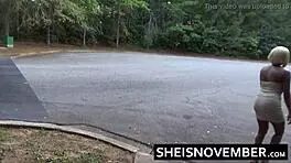 Ebony girl MsNovember squatting pissing public in skirt upskirt heels.