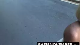 Ebony girl MsNovember squatting pissing public in skirt upskirt heels.