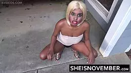 Ebony girl MsNovember squatting pissing public in skirt upskirt heels.