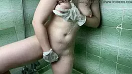 My step sister masturbates in shower with latex gloves