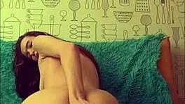 Beautiful brunette playing with her anal