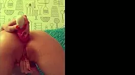 Beautiful brunette playing with her anal