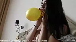 Egle pops balloons seductively at birthday party