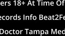 Teen brunette giggles as her feet get wet at the beach on beat2feetcom.