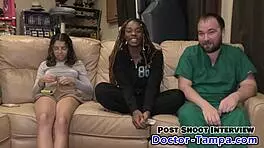 Teen brunette giggles as her feet get wet at the beach on beat2feetcom.