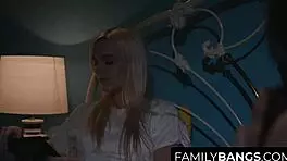 petite teens share midnight kisses in family setting