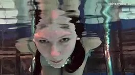 Katya Okuneva is at the pool, bouncing her tits in a dress and bikini