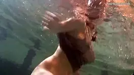 Katya Okuneva is at the pool, bouncing her tits in a dress and bikini