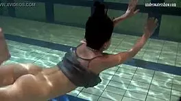 Katya Okuneva is at the pool, bouncing her tits in a dress and bikini