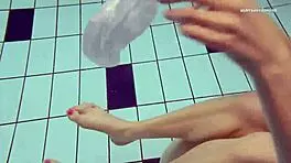 Nastya volna swims gracefully underwater like a wave in the pool