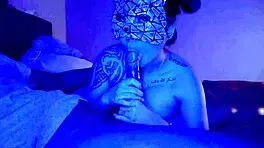 Asian woman performs sloppy deepthroat blowjob on big black cock, her big tits bouncing.