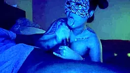 Asian woman performs sloppy deepthroat blowjob on big black cock, her big tits bouncing.