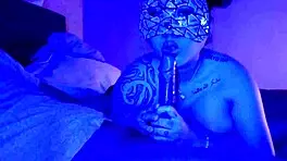 Asian woman performs sloppy deepthroat blowjob on big black cock, her big tits bouncing.