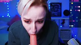 in a homemade video, a tattooed blonde teen with short hair and small tits sucks on a dildo solo