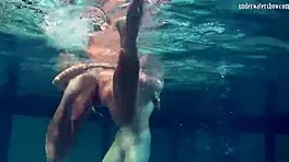 underwater lesbian bathing turns steamy on beach