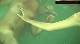 Hot Lesbian Teens Engage in Underwater Pussy Sucking and Tit Play