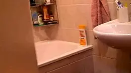 Solo Blonde Babe Showers and Pleasures Her Shaved Pussy