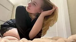 Blonde teen teases with striptease, undresses, and sucks big dildo with big tits and ass