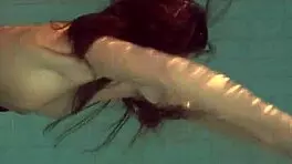 Natalia Kupalka swims naked in the pool, looking cute