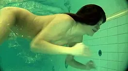 Natalia Kupalka swims naked in the pool, looking cute