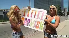 Katerina Kay and Cali Carter, those car wash babes, get shaved and fingered. Petite teens enjoy cunilingus and muff diving in the car.