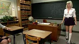 busty milf professor guides student in classroom activity