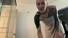 Young 18+ thug with tattoo twerks big ass in kitchen shorts, hairless close-up amateur dancing