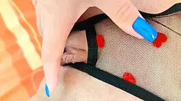 Excited beauty masturbates her shaved pussy alone in sexy lingerie